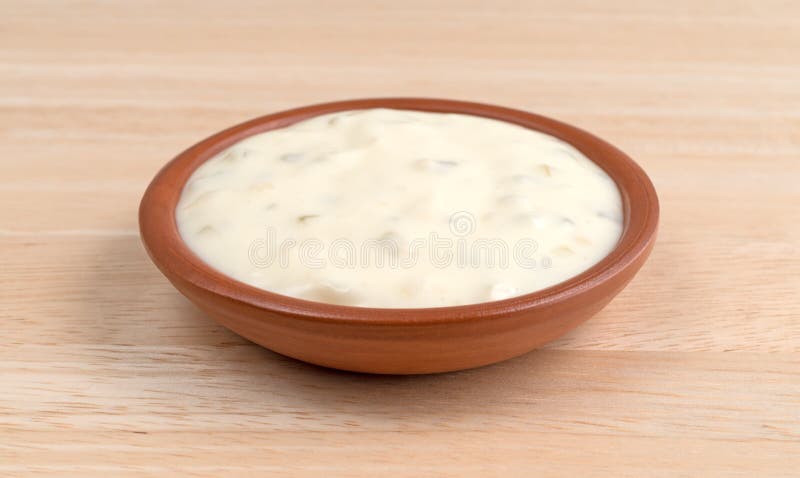 Small bowl of tartar sauce on a wood table royalty free stock photography Small bowl of tartar sauce on a wood table royalty free stock photography