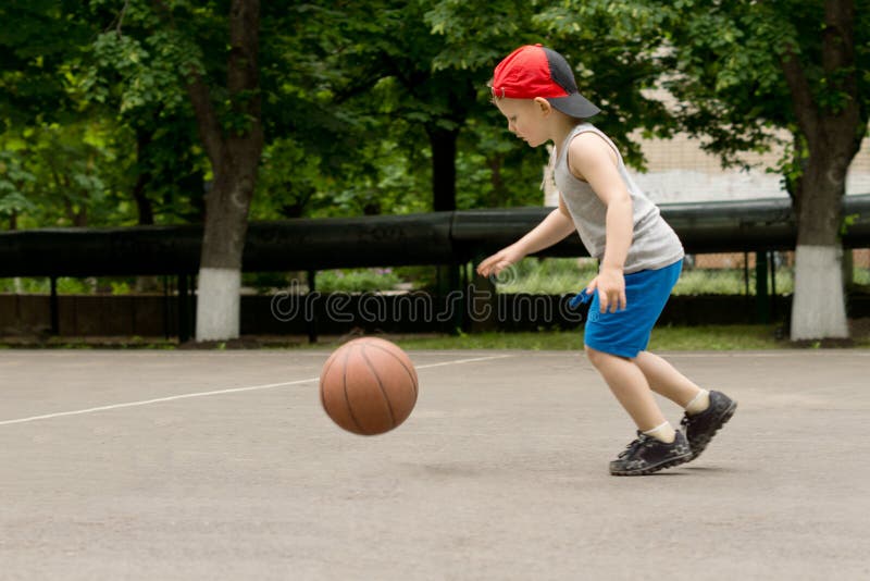 Boy Bouncing On Ball In Living Room