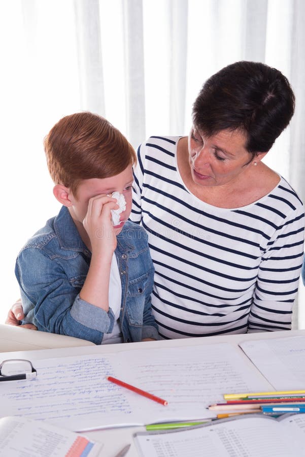 Small boy gets comforted by mother stock photos Small boy gets comforted by mother stock photos