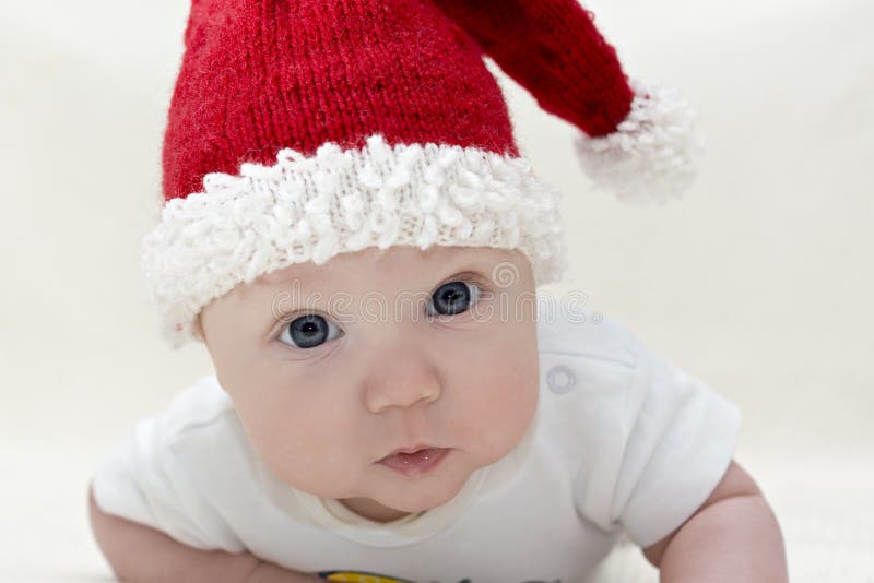 Small boy in knitted red hat stock images