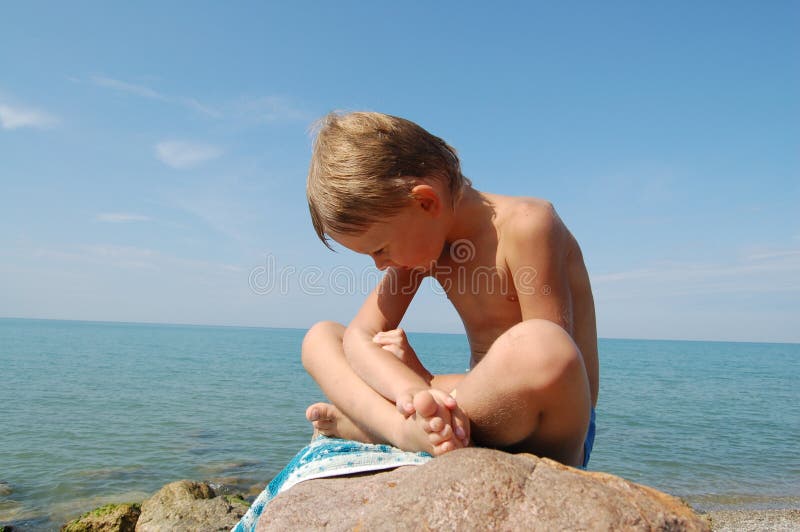 Small boy and sea