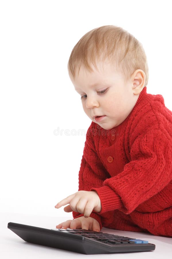 Small boy studies to count with the calculator