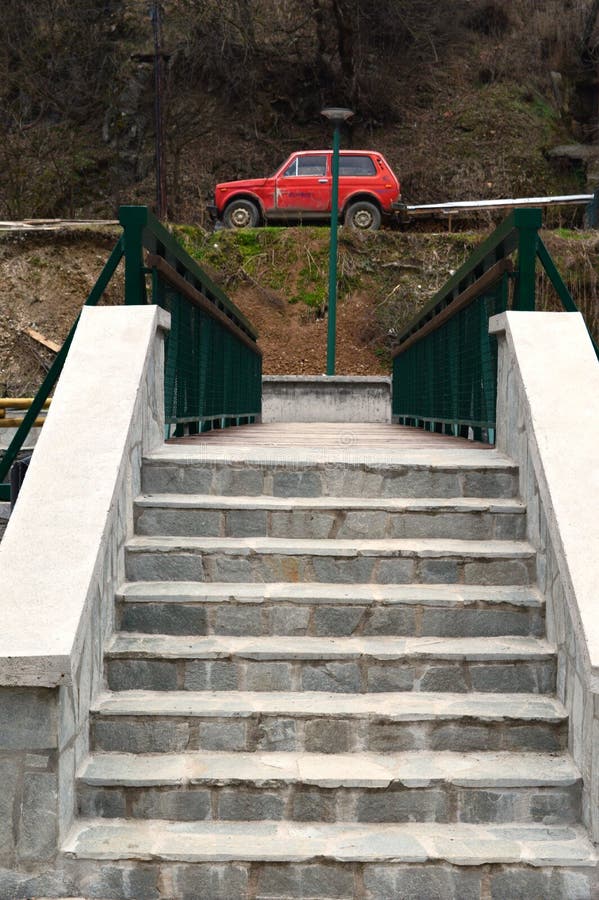 Small bridge and a red car stock photo. Image of nature 212076258