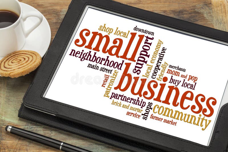 Small business word cloud on a digital tablet with a cup of coffee