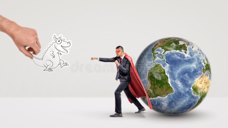 A small businessman in superhero cape beside a globe ready to fight off a paper dragon held by a giant hand. stock photography A small businessman in superhero cape beside a globe ready to fight off a paper dragon held by a giant hand. stock photography