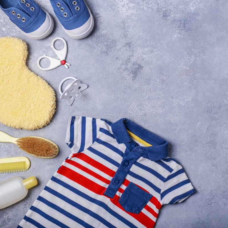 Small Child or Baby Boy Accessories on Grey Background Stock Image