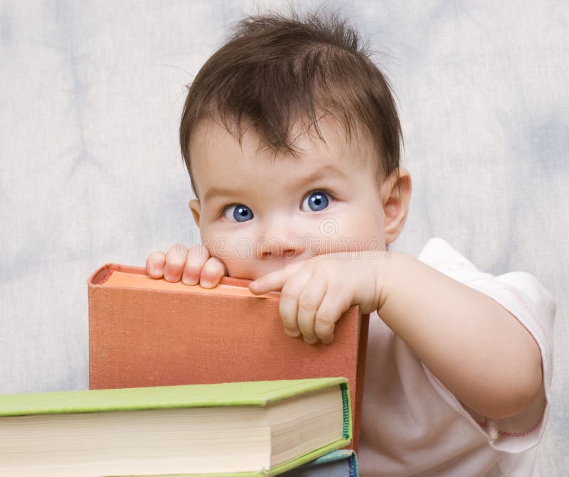 The small child with books