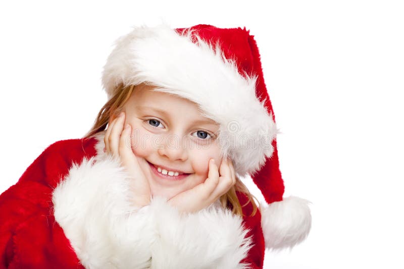 Small child dressed as santa claus smiles happy