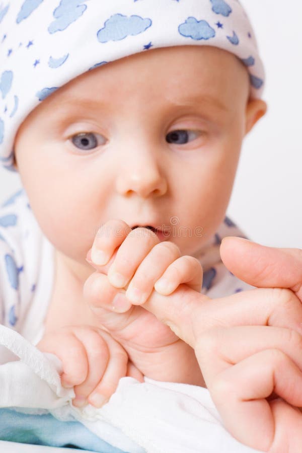 Small child holding mother s finger