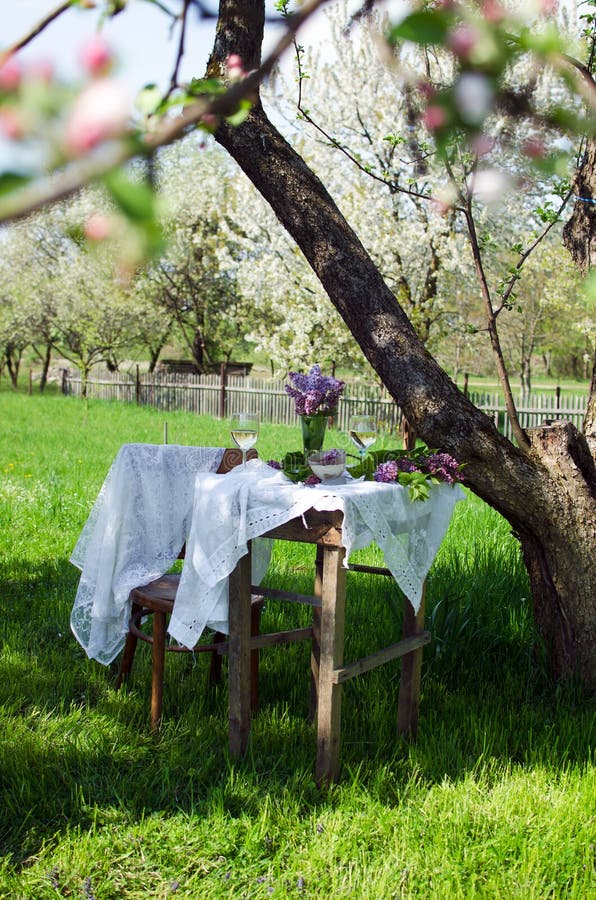 Small coffee table and a wooden chair under an