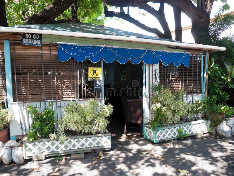 Small cottage house in Hawaii with planters in front royalty free stock photography