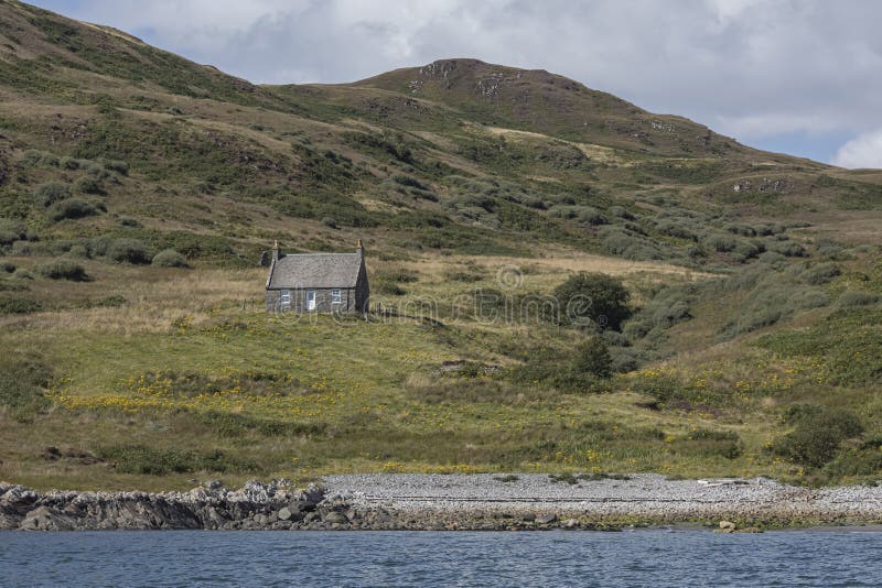 A small cottage on a scottish island royalty free stock images