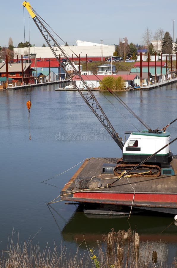 Small Crane on a Stern of a Barge. Stock Photo Image of trees