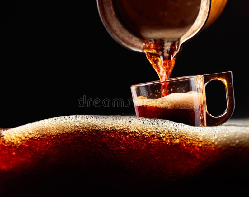 Small Cup of Coffee on a Black Background. Copy Space Stock Image