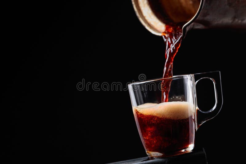 Small Cup of Coffee on a Black Background. Copy Space Stock Image