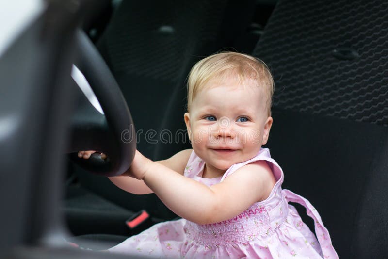 Small cute baby in a car stock photo. Image of nice, sandals 77645440