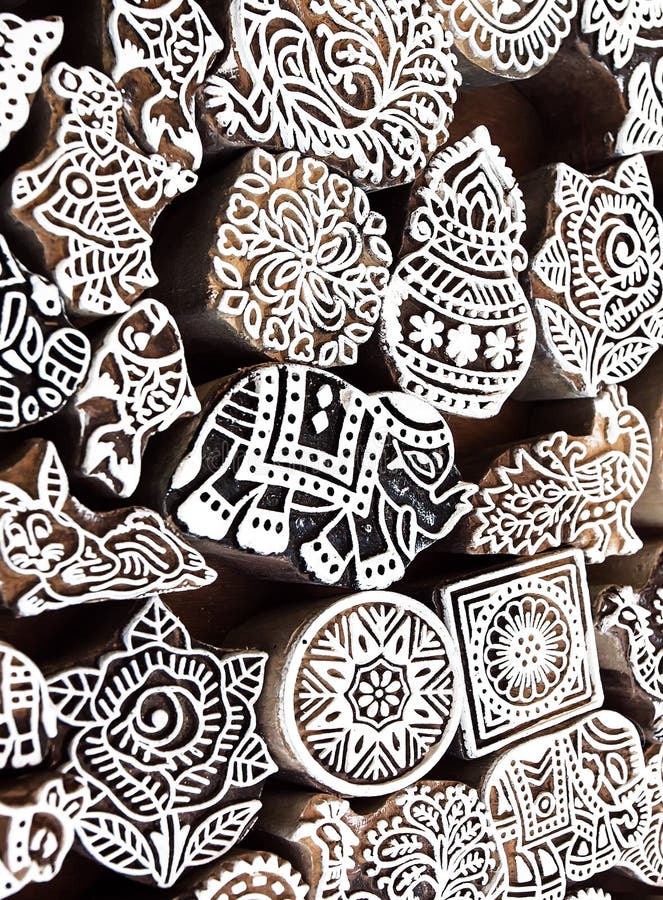 Small elephant and other symbols and patterns on wooden mold blocks for traditional printing textile. Design in India stock photos Small elephant and other symbols and patterns on wooden mold blocks for traditional printing textile. Design in India stock photos