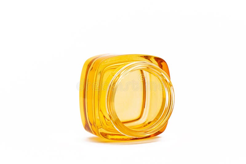 Empty yellow glass jar stock image