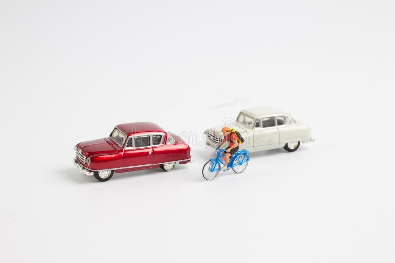 Small Figure and Toy Car and Bike Stock Image Image of business