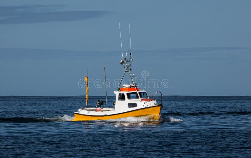 Image of a small commercial fishing boat. Image of a small commercial fishing boat.