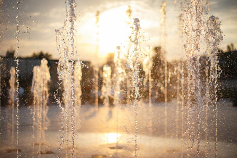 Small Fountain with Water Streams Beating from Below Stock Photo