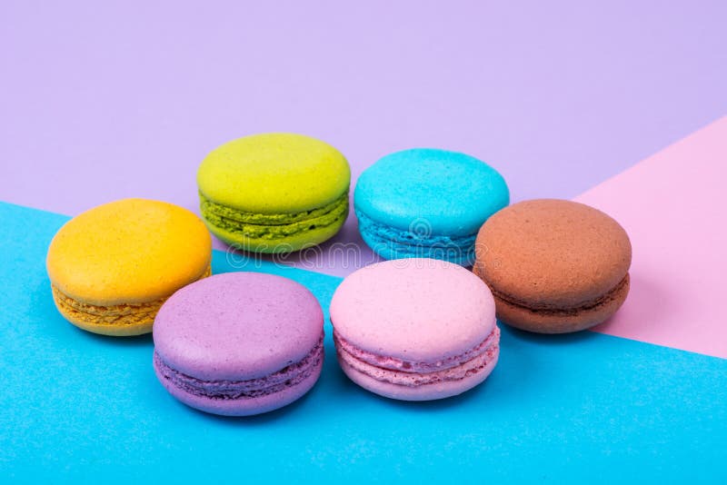 Small French Macaroons on Pastel Background Stock Photo - Image of ...