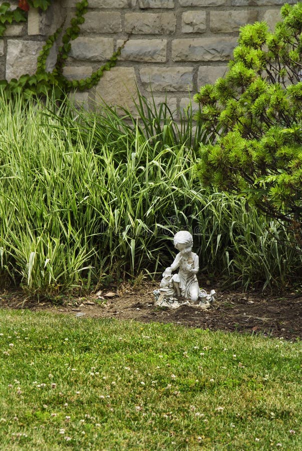 Small Garden Statue stock photo. Image of spring, grass 17440220