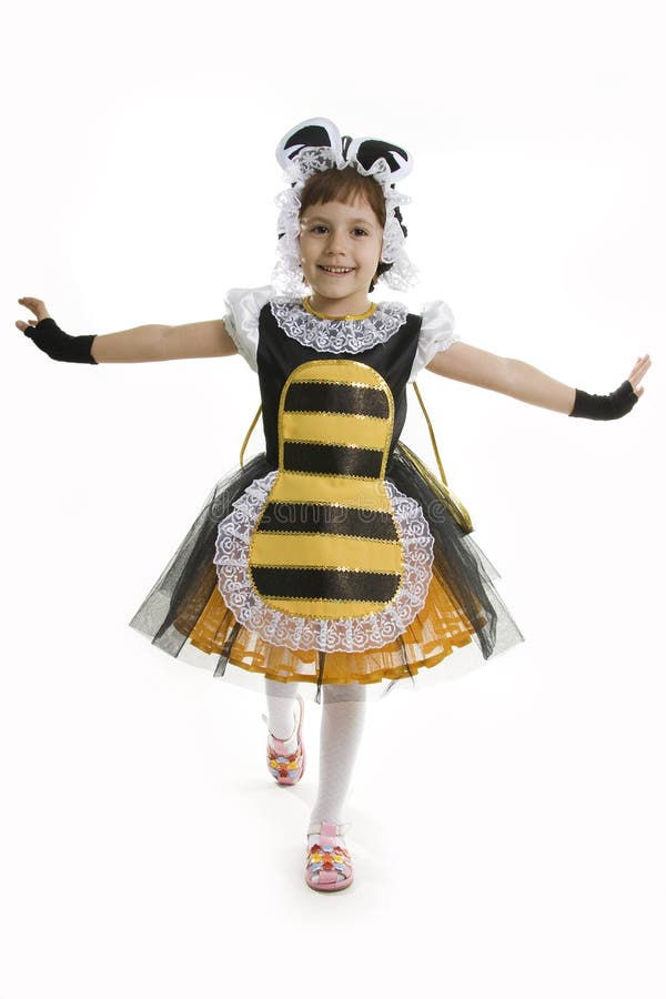 Small girl is bee costume.