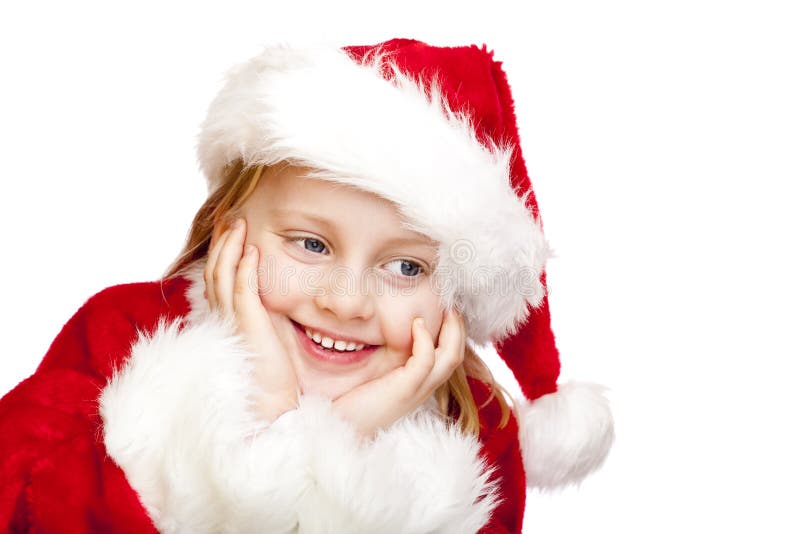 Small girl dressed as santa claus smiles happy