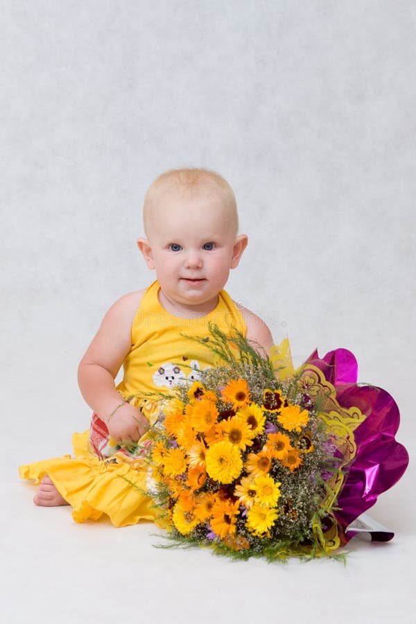 A small girl with a great flower bouquet