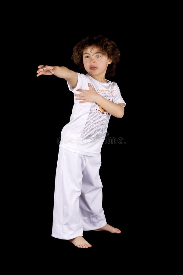 Small girl making karate hit