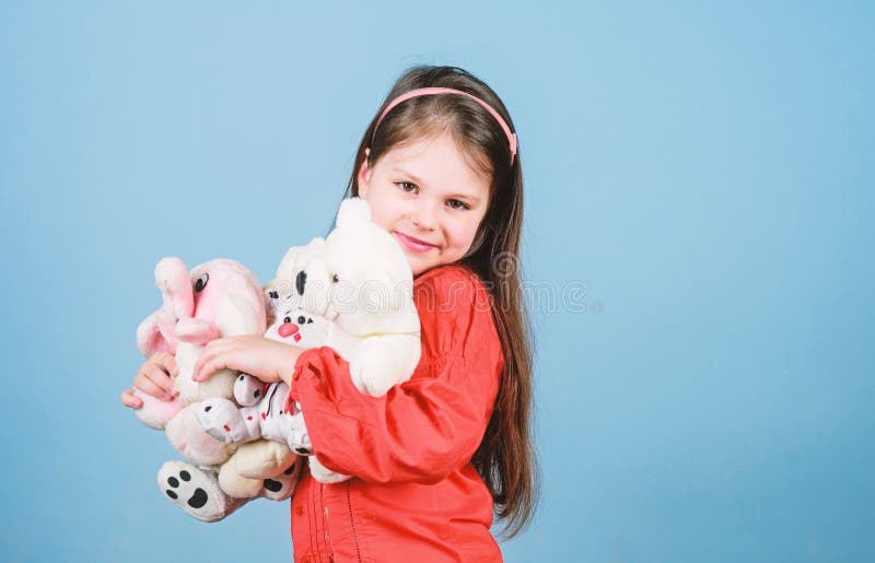 Small girl with soft bear toy. child psychology little girl play game in playroom. happy childhood. Birthday. hugging teddy bear. toy shop. childrens day. Best friend. Moments of love and happiness.