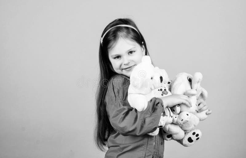 Small girl with soft bear toy. child psychology little girl play game in playroom. happy childhood. Birthday. hugging teddy bear. toy shop. childrens day. Best friend. Moments of love and happiness.
