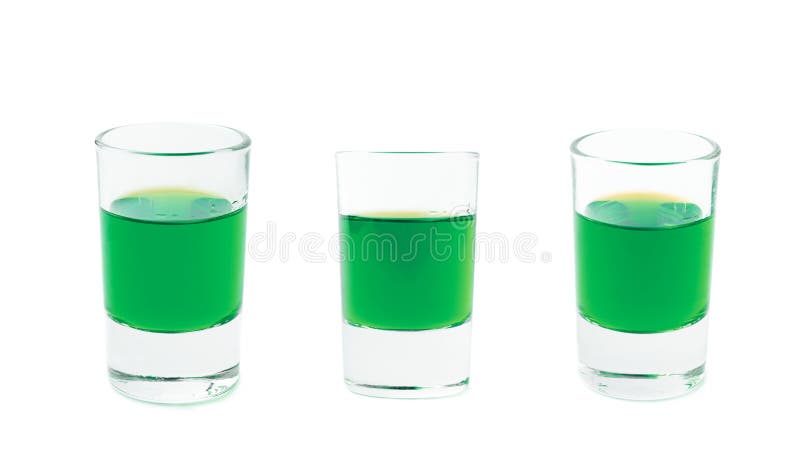 Small glass shot filled with liqueur isolated stock image Small glass shot filled with liqueur isolated stock image