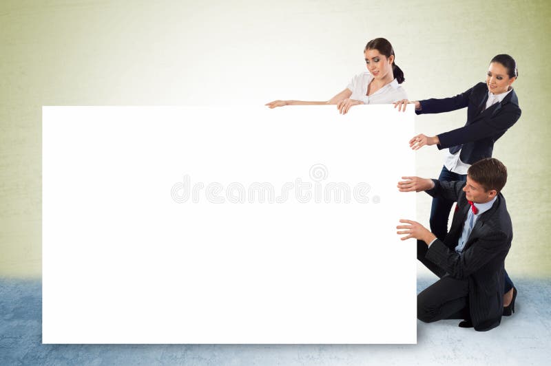 Small group of people holding a blank banner royalty free stock image