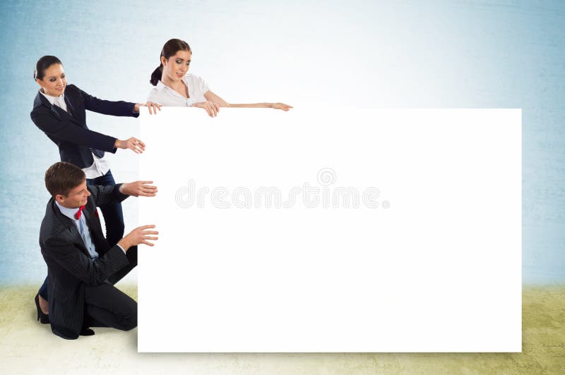 Small group of people holding a blank banner stock photo