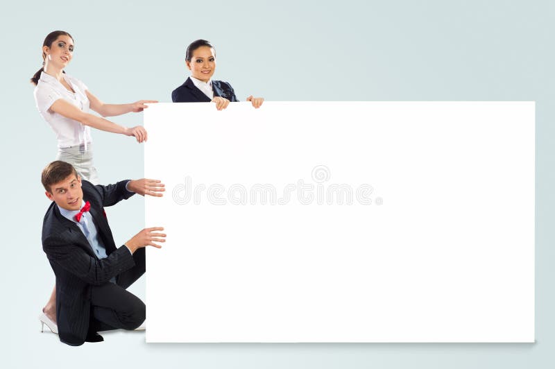 Small group of people holding a blank banner stock image