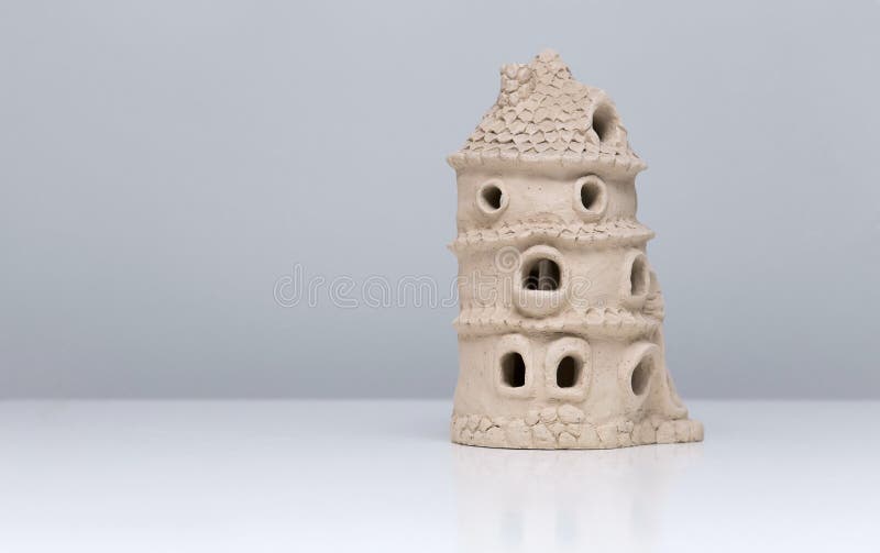 Ceramic doll house made of clay.