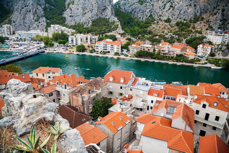 Small houses and river Cetina in town Omis
