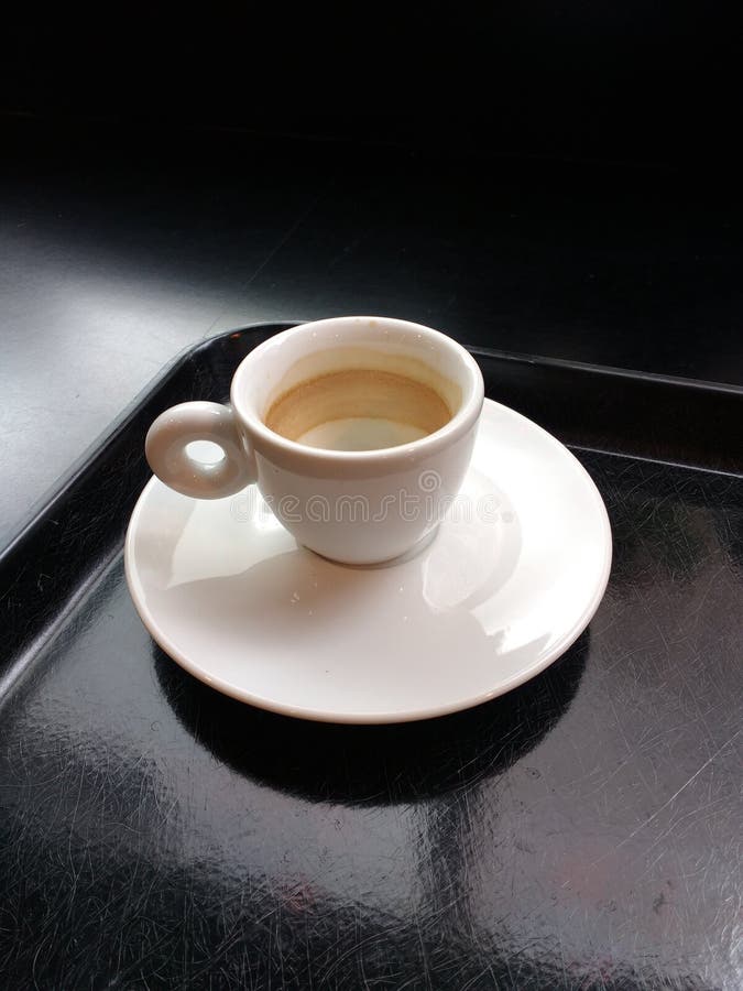 Small Ivory White Demitasse Espresso Cup with Matching Saucer on a