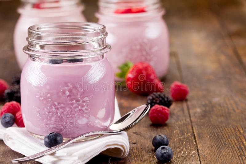 Small jars with homemade yogurt with berries