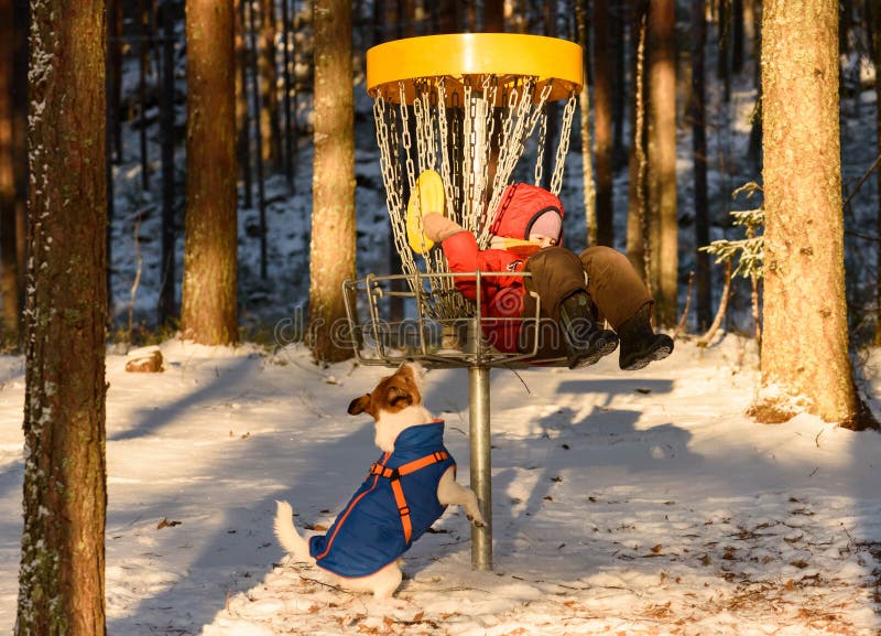 Small Kid Playing with Plastic Disk and Pet Dog at Disc Golf Par Stock Image Image of disc