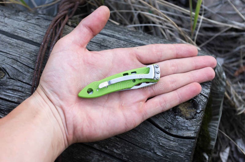 A Small Knife in the Palm of Your Hand. Stock Photo Image of blade