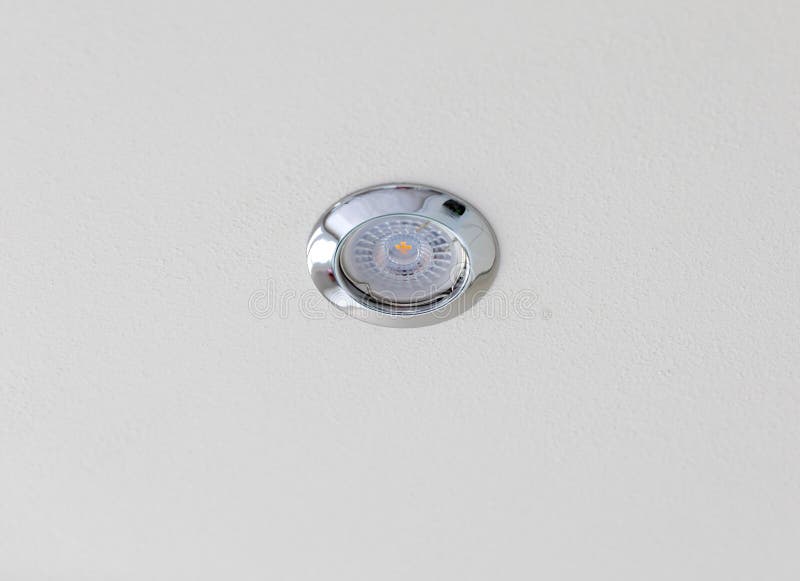 Small led spotlight illuminating white ceiling stock photos