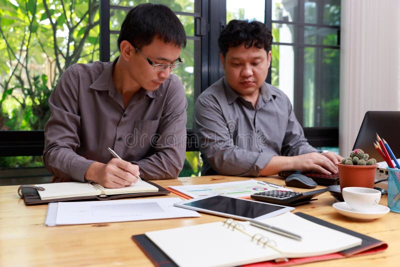 Small and Medium Enterprise Business concept of ,Businessman discussing investment plan with his partner in office