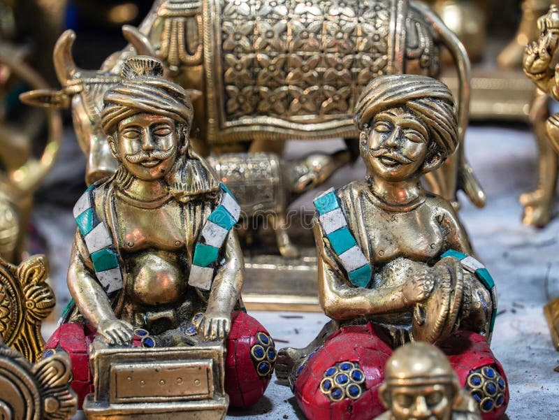 Small Metal Statues of Traditional Indian Men Which is Playing Musical