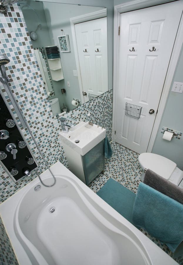 Small Modern Plain White Bathroom With An Alcove Bathtub With Glass
