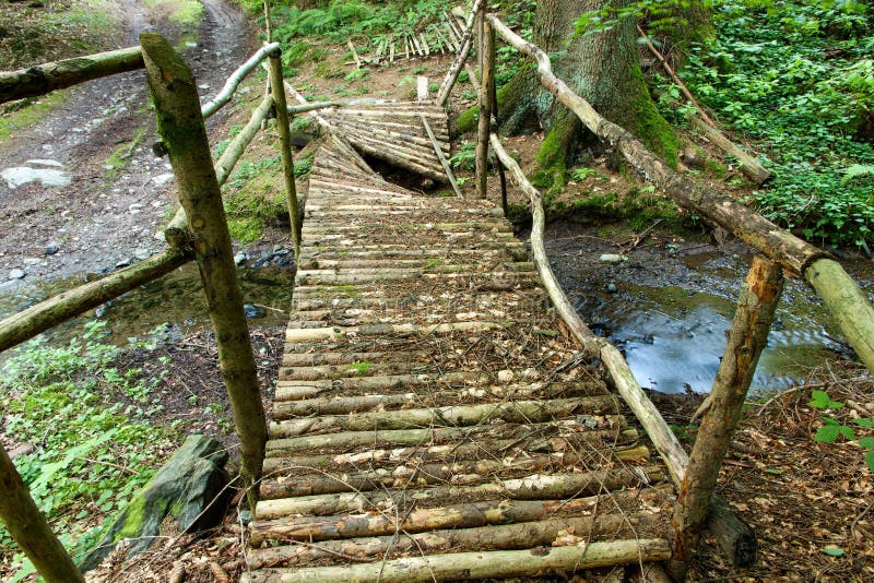 Small old broken wooden bridge