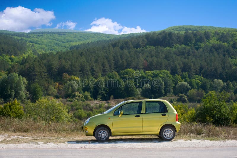 Small olive green car stock photography