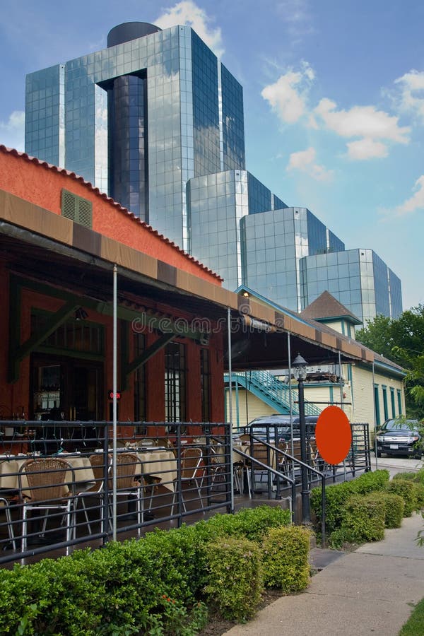 Patio restaurant with large office building in the background. Patio restaurant with large office building in the background